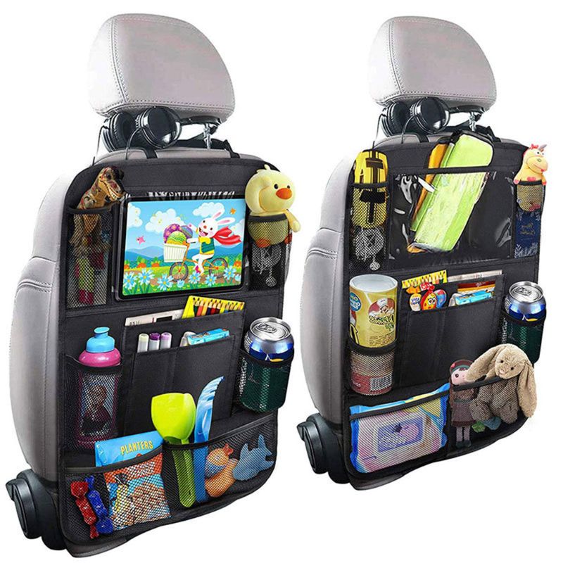 A black car storage bag hanging on the back of a car seat, providing convenient organization and storage for various items during travel.