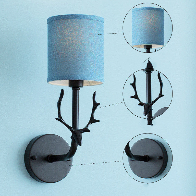 Modern Nordic style wall lamp with wrought iron antlers and cloth lampshade, available in various colors and light source options. Perfect for bedrooms, living rooms, and hotels.